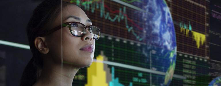 Woman looking at see through global and environmental data