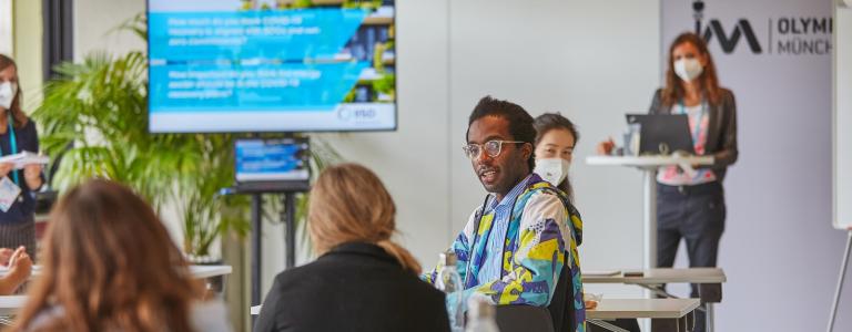 Participants discuss during the One Young World workshop