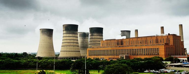 Landscape featuring a coal power station with towers in South Africa.