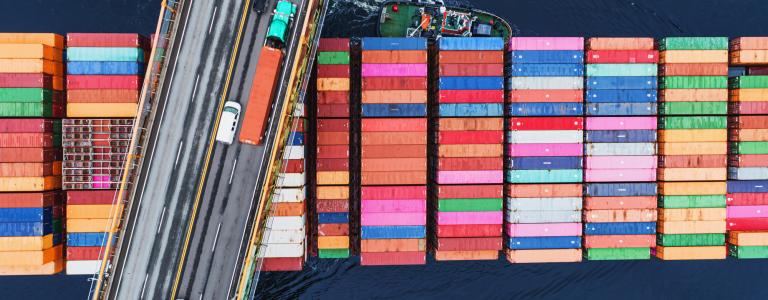 Image of cargo crates and a highway overtop