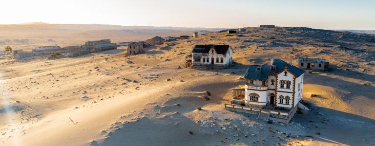 Deserted homes in Kolmanskop ghost town near Luderitz in Namibia, the site of an abandoned diamond mine