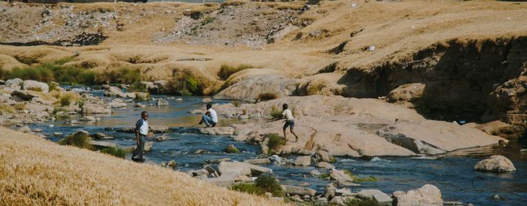 SUNCASA Kids playing on Jukskei River, Alexadra Township, Johannesburg, South Africa