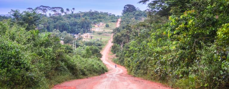 Rural road going through a hill in Liberia