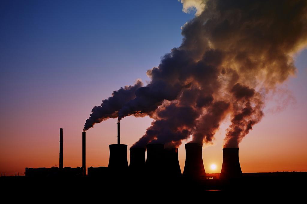 smoke stacks at sunset